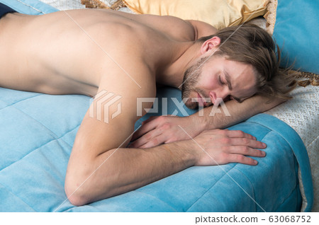 Lost in a deep sleep. Handsome man having sleep in 63068752