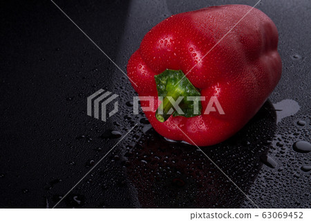Pepper with red peel. Pepper with red peel. 63069452