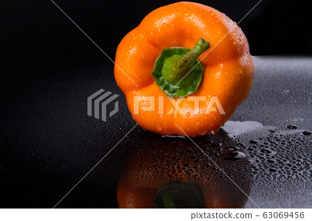 Wet capsicum annuum is in focus. Wet capsicum annuum is in focus. 63069456