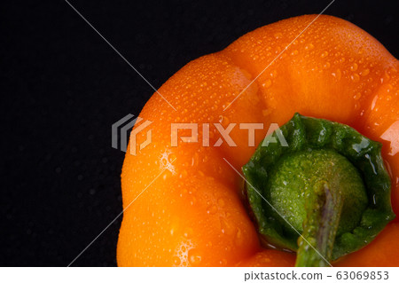 Orange pepper with little drops detailed. Orange pepper with little drops detailed. 63069853