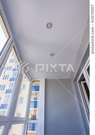 Stretch ceiling in the interior of a small balcony Stretch ceiling in the interior of a small balcony 63070007
