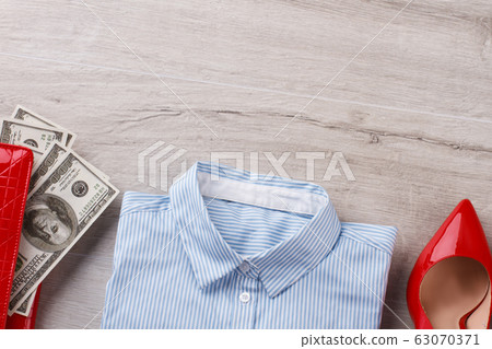 Office shirt, heels and wallet with money 63070371