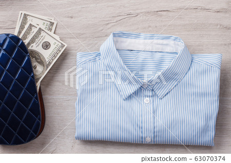 Office shirt and wallet with money. Office shirt and wallet with money. 63070374