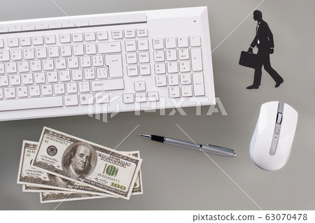White keyboard and optical mouse on gray surface close up. White keyboard and optical mouse on gray surface close up. 63070478