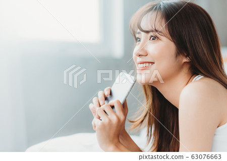 Beautiful woman wake up morning 63076663