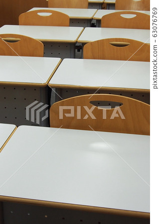 Desks and chairs arranged Desks and chairs arranged 63076769