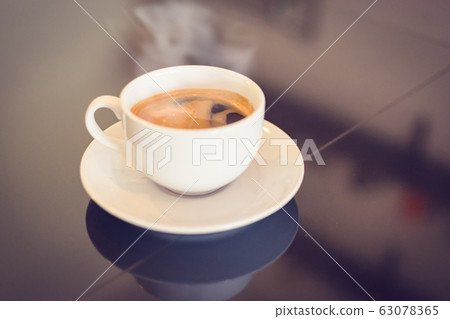 Coffee cup in film tone style. Copy space for text Coffee cup in film tone style. Copy space for text 63078365