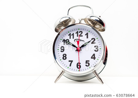 Metal retro alarm clock on white background 63078664