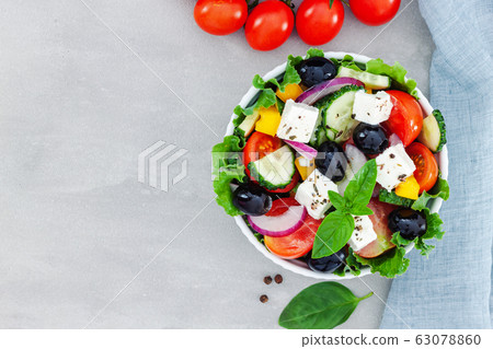 Green salad with tomato and fresh vegetables Green salad with tomato and fresh vegetables 63078860