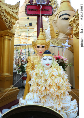 Famous tourist destination of Yangon (Myanmar) Golden pagoda Buddha statue at Shwedagon Pagoda 63084661