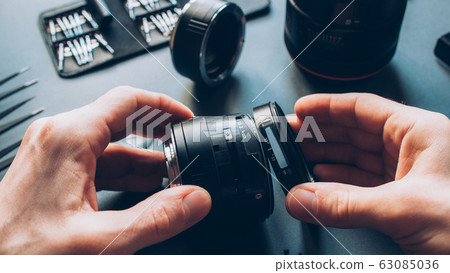 electronic device maintenance photo camera lens electronic device maintenance photo camera lens 63085036
