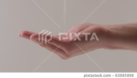 pour shower gel on man hand closeup pour shower gel on man hand closeup 63085898