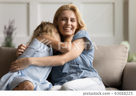 Happy mother and small daughter playing at home 63088225