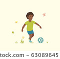 African American Boy Plays with a Soccer Ball 63089645