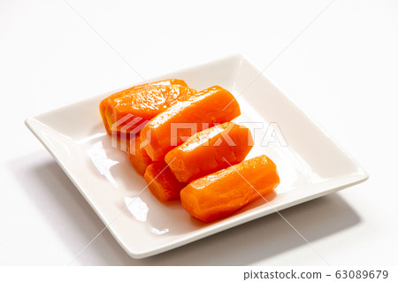 Carrot glasse. (White plate, white background) Carrot glasse. (White plate, white background) 63089679