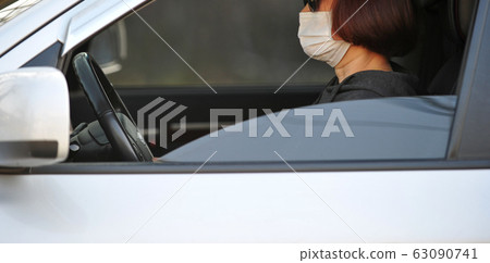 Korean women driving with mask Korean women driving with mask 63090741
