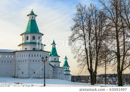 Snow and white towers with green roof of New 63091997