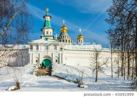 Snow and white walls, golden domes and a tower 63091999
