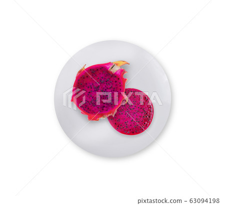 Dragon Fruit top view on white plate Dragon Fruit top view on white plate 63094198