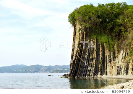 View of the gentle side of the Kiselev rock . black sea coast. Beautiful view of the rock. Walk along the shore. View of the gentle side of the Kiselev rock . black sea coast. Beautiful view of the rock. Walk along the shore. 63094759