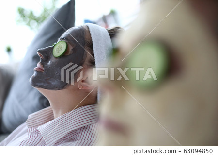 Friends with cucumbers on eyes Friends with cucumbers on eyes 63094850
