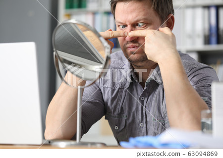 Male in office workplace 63094869