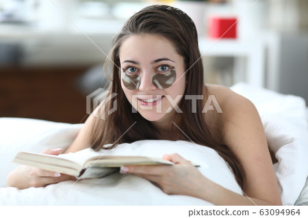 Lady applying patches 63094964
