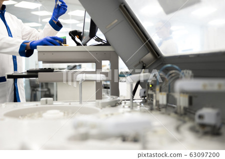 Male scientist doing biochemical blood test in laboratory 63097200