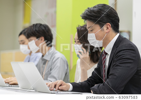 People working in masks 63097583