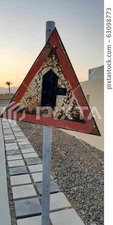 Old in poor condition road sign made of metal Old in poor condition road sign made of metal 63098773