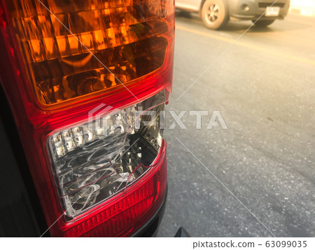 Car tail lights that were broken due to an 63099035