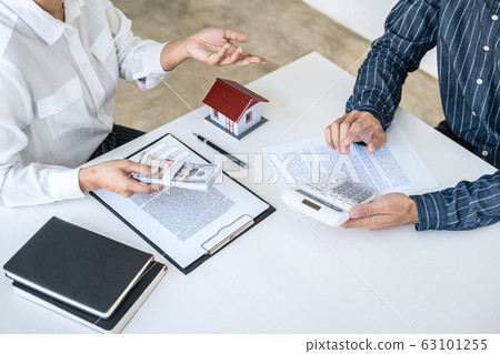 Real estate broker agent being analysis and making 63101255