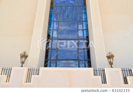 The texture of a large huge glass blue window The texture of a large huge glass blue window 63102155
