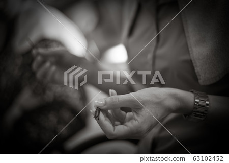 Hairdresser doing a woman's hair in monochrome 63102452