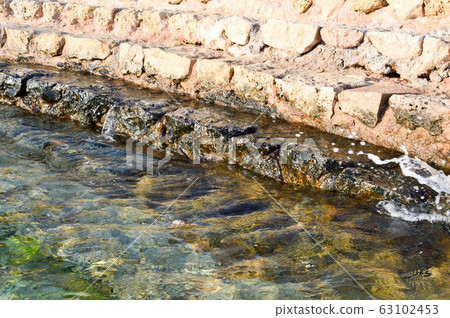 Old ancient yellow stone steps from 63102453