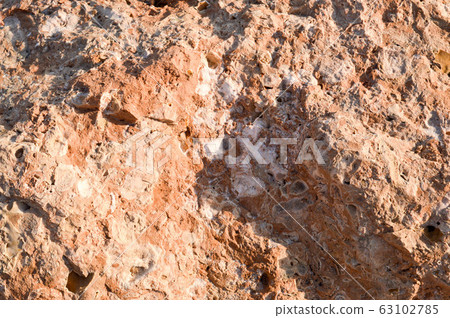 The texture of a brown, bulging, sharp porous The texture of a brown, bulging, sharp porous 63102785