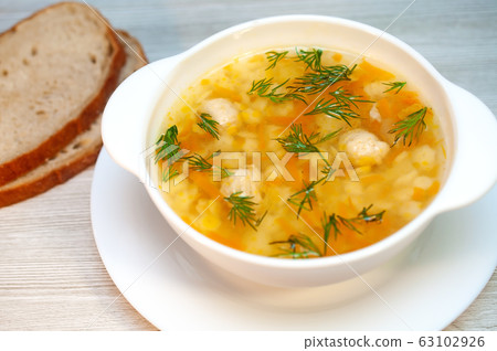 Chicken soup with meatballs and pasta on the table Chicken soup with meatballs and pasta on the table 63102926