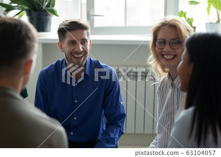 Overjoyed diverse people have fun engaged in team therapy indoors Overjoyed diverse people have fun engaged in team therapy indoors 63104057