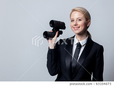 businesswoman in a classic black business suit 63104873