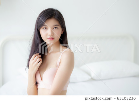 Beautiful portrait young asian woman sexy in underwear figure fit relax with seductive in bedroom Beautiful portrait young asian woman sexy in underwear figure fit relax with seductive in bedroom 63105230