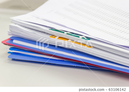 file folder and Stack of business report paper 63106142
