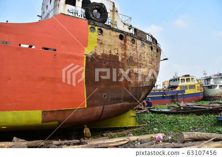 Dhaka, Bangladesh Retro shipyard along the Brigonga River Workers repairing old ships Silently working 63107456