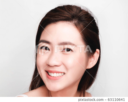young beautiful asian woman with clean and bright skin, Cosmetic Beauty Concept,smiling face 63110641