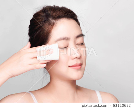 young beautiful asian woman with clean and bright skin, Cosmetic Beauty Concept,smiling face 63110652