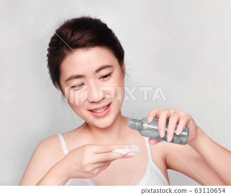 young beautiful asian woman with clean and bright skin, Cosmetic Beauty Concept,smiling face 63110654