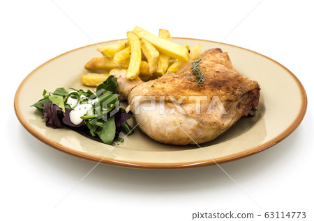Roasted chicken leg with fries and vegetables Roasted chicken leg with fries and vegetables 63114773