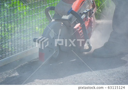 Fragment of a joint cutter on a brushed concrete Fragment of a joint cutter on a brushed concrete 63115124