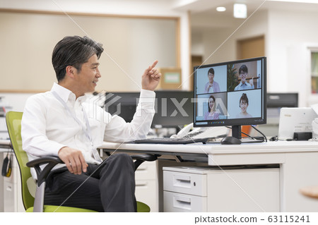 Businessman holding a web conference @ office image 63115241