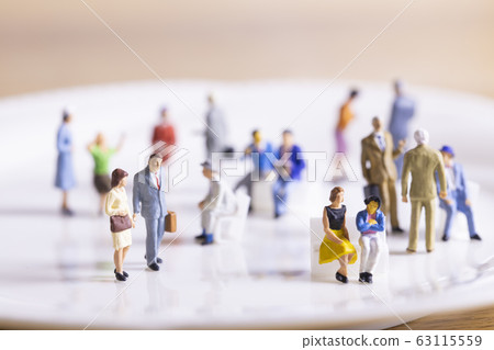 Businessmen walking in a crowd Businessmen walking in a crowd 63115559