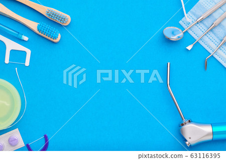 Dentist tools over blue background top view 63116395